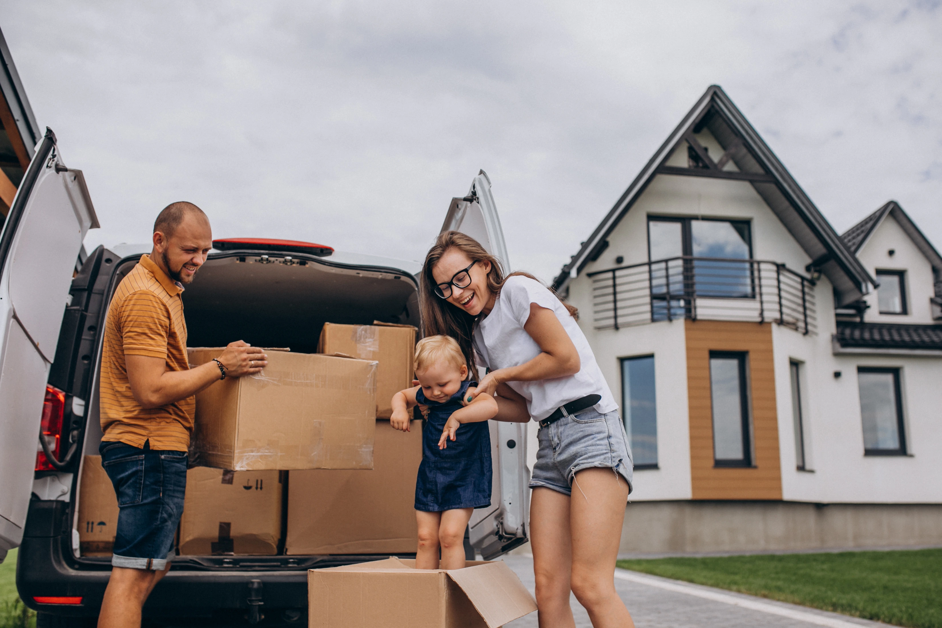 Couple moving into beautiful new home with professional help